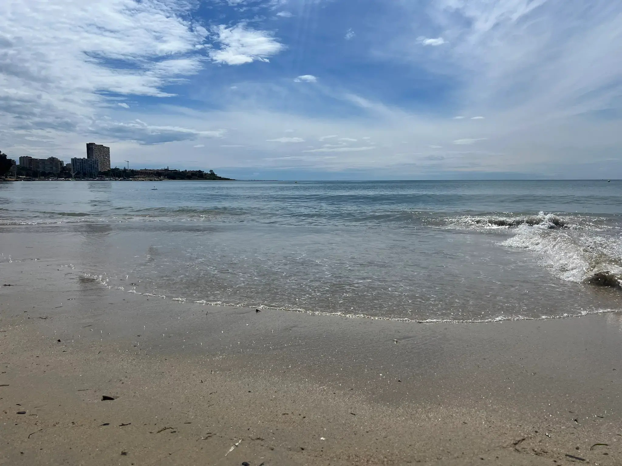 Crystal clear calm water at Albufereta bay, perfect for swimming.