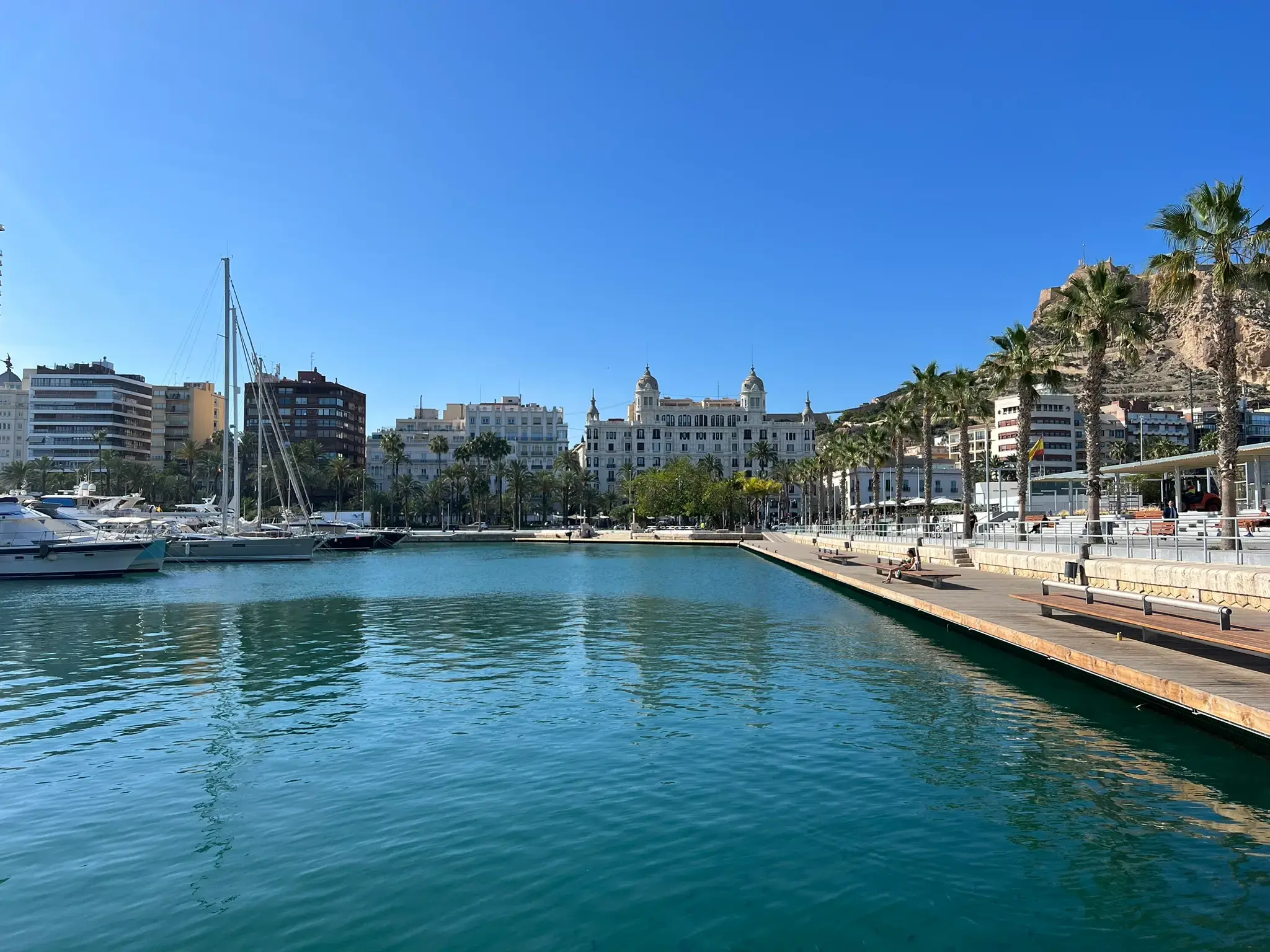 Alicante marina with yachts and Santa Bárbara castle in the background
