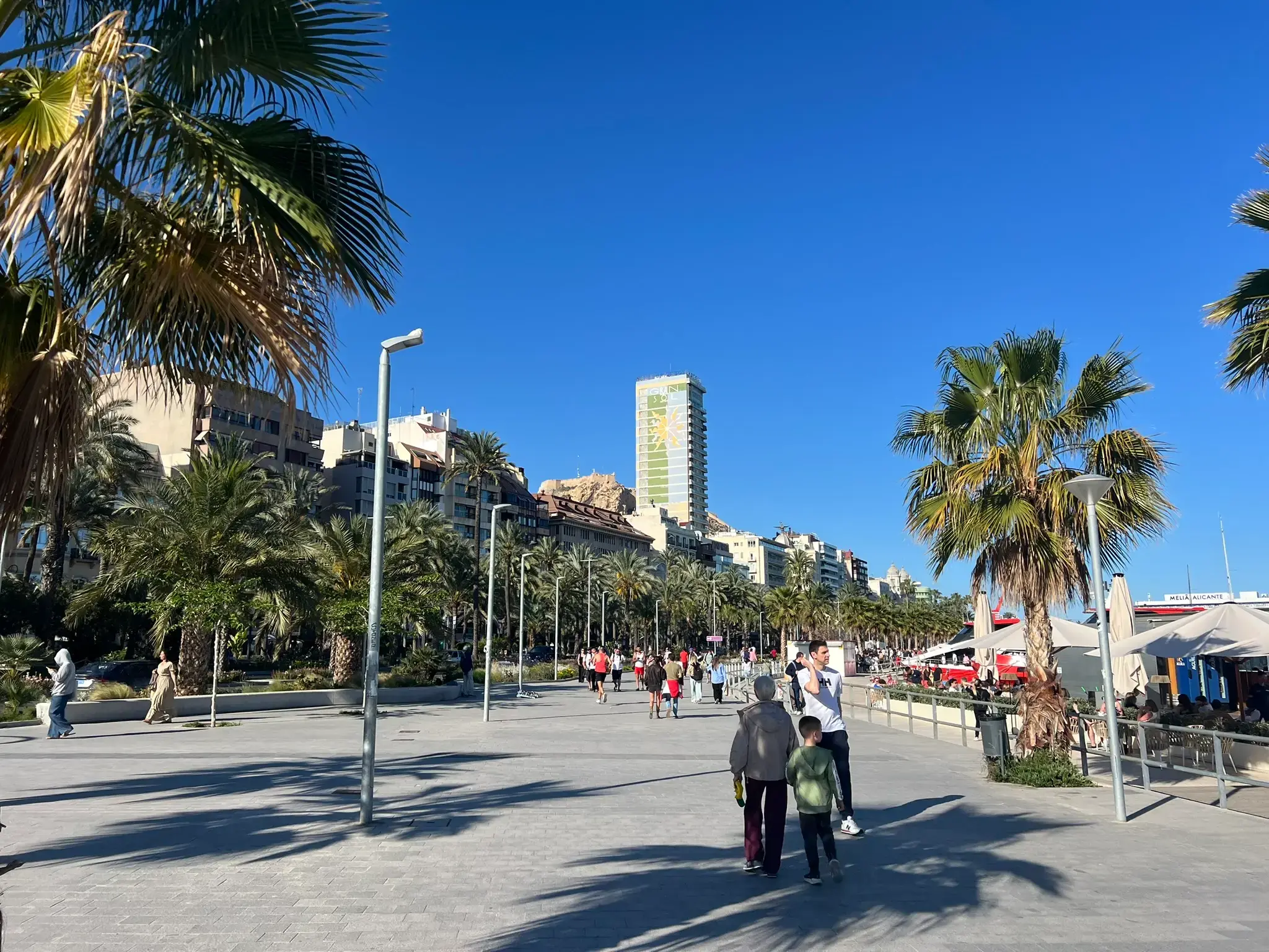 Alicante Marina promenade with Gran Sol hotel and Santa Bárbara Castle