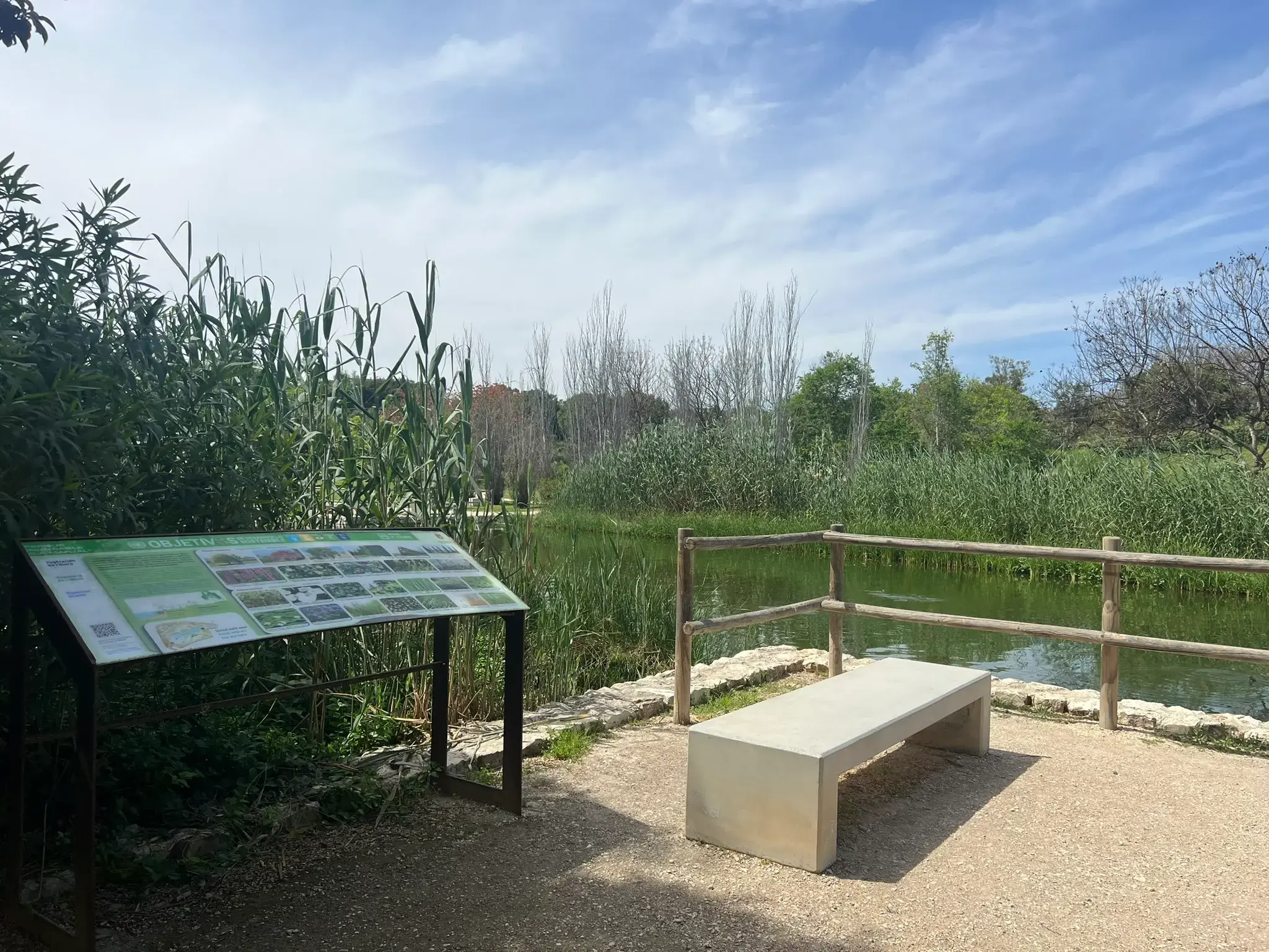 Educational information panel beside the lake at Parque La Marjal Alicante.