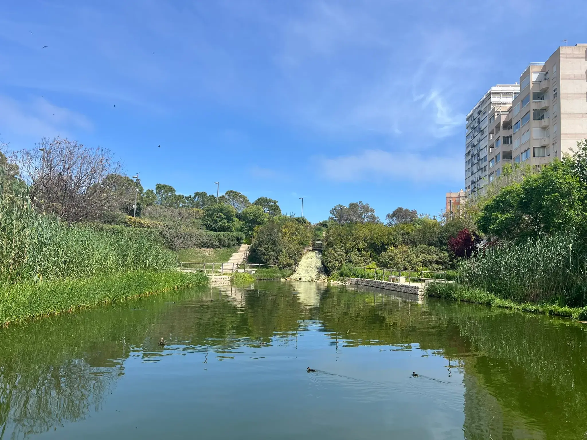 Small waterfall feeding into the lake at Parque La Marjal Alicante.
