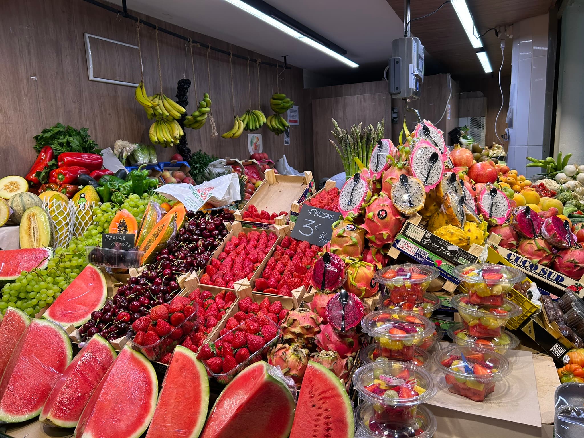 Fruit stall with strawberries and watermelons